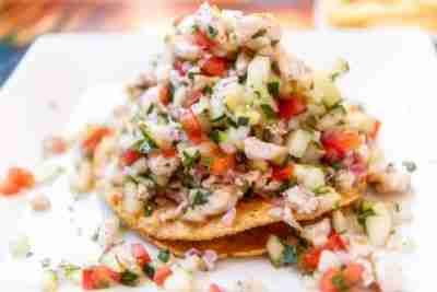 Mexican Shrimp Ceviche Tostada (Tostada de Ceviche de Camaron) in a restaurant table