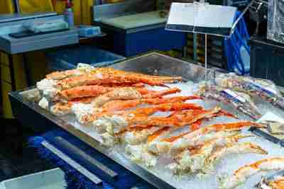 Steamed king crab legs at seafood market in Osaka Japan.