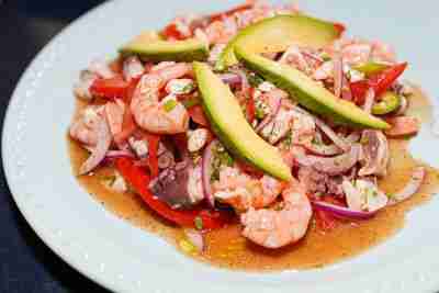 Fresh and vibrant seafood ceviche with shrimp, octopus, avocado, and a medley of vegetables