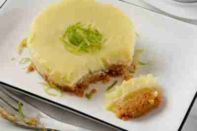 Individual Key Lime Cheesecake with Graham Cracker Crust and a cup of Coffee